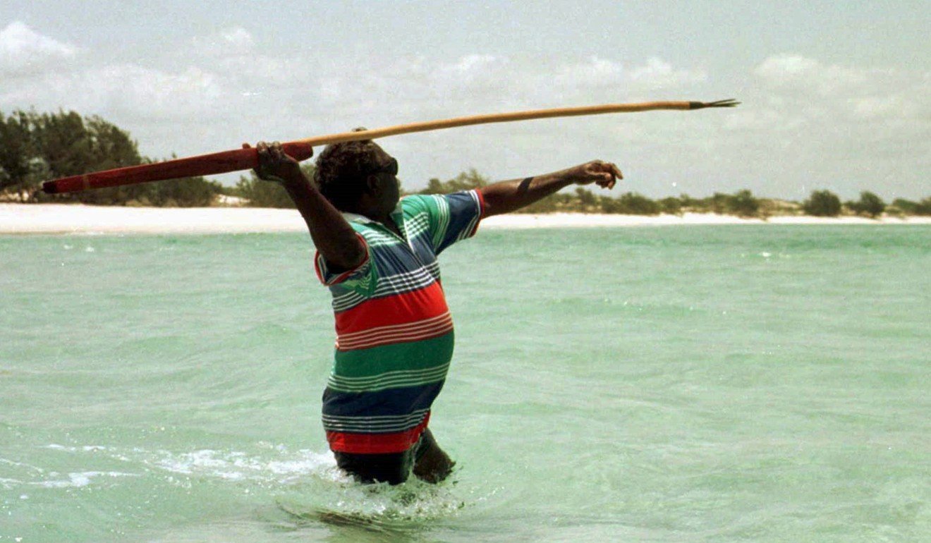 Northern Land Council chairman Galarrwuy Yunupingu uses a traditional Aboriginal spear to catch fish near his family’s outstation on Aboriginal traditional homelands in the Northern Territory. Picture: Reuters
