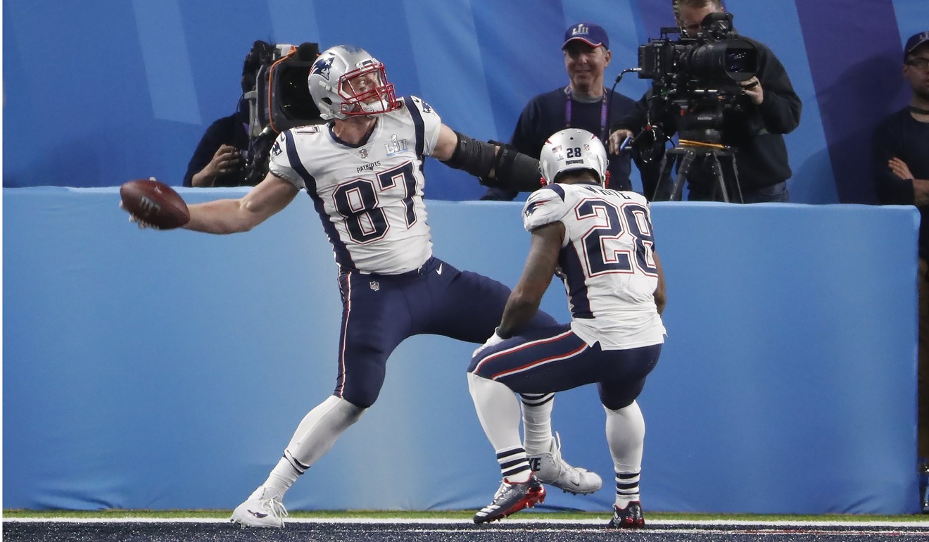 New England Patriots tight end Rob Gronkowski (L) celebrates after scoring a touchdown in the fourth quarter of Super Bowl LII at US Bank Stadium in Minneapolis. Photo: EPA