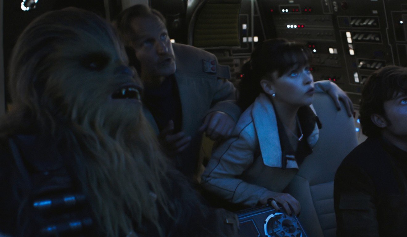 Joonas Suotamo as Chewbacca, Woody Harrelson as Beckett, Emilia Clarke as Qi’ra and Alden Ehrenreich as Han Solo in a still from Solo: A Star Wars Story.