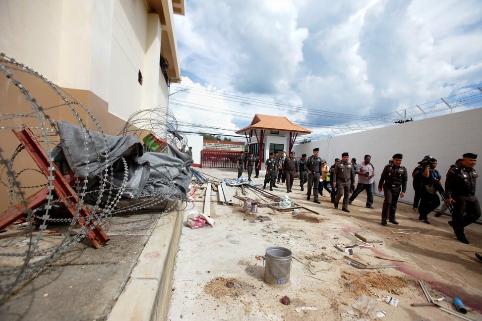 Twenty Uygurs broke out of a cell near the Thai-Malaysian border by digging holes in the wall and using blankets as ladders. Photo: AFP