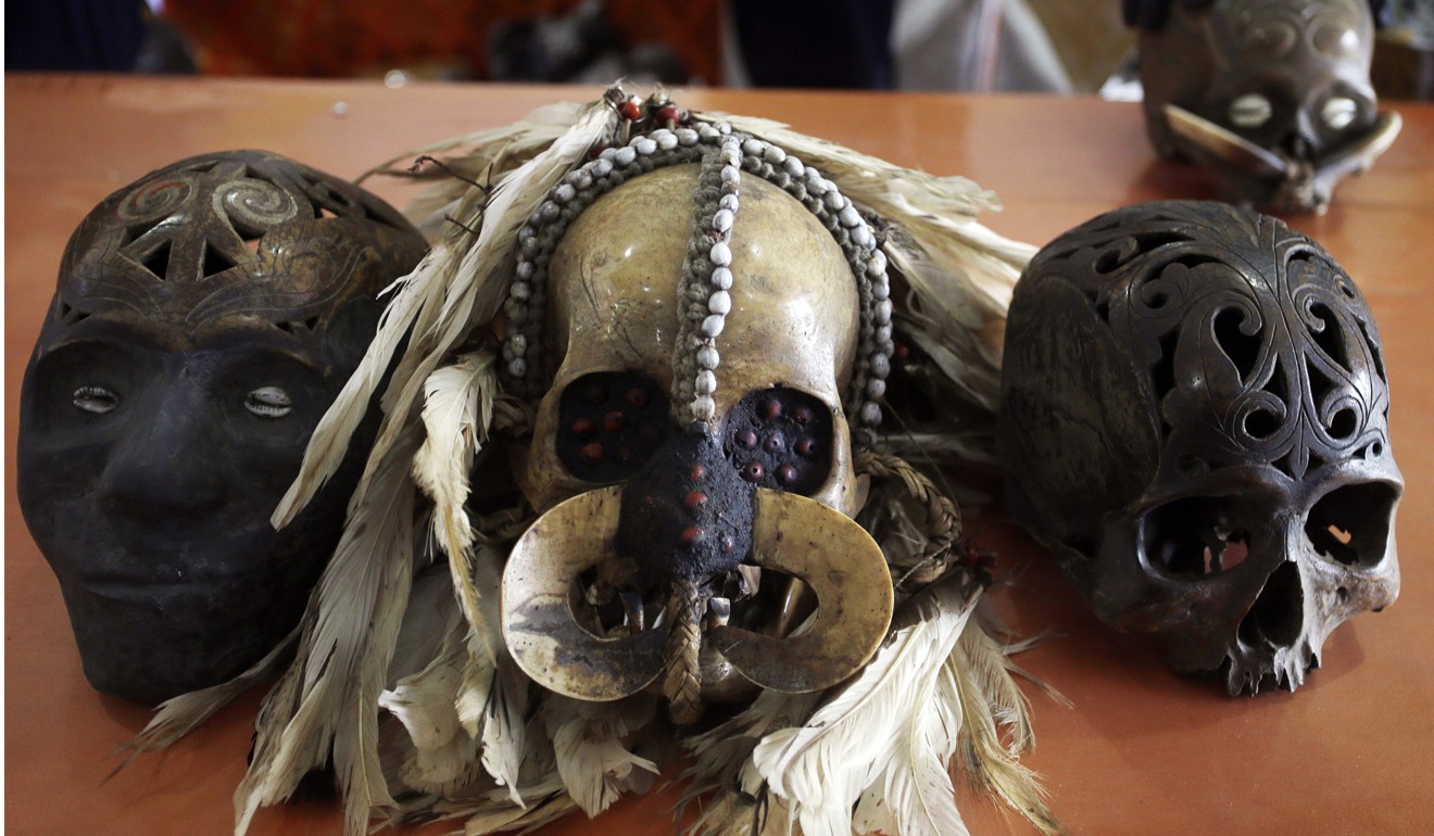 Customs officers display some of the 24 human skulls, believed to be from Papua and Kalimantan, after they were stopped from being posted to the Netherlands. Photo: AP