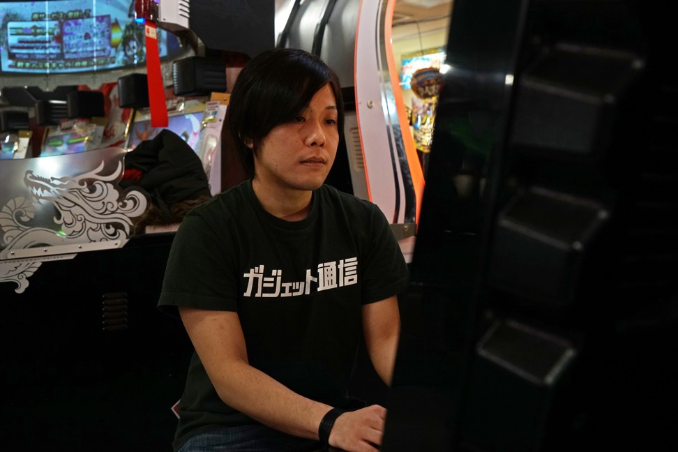 E-sports player Yota Kachi plays Bandai Namco Holdings Inc’s video game Tekken, at an arcade in Tokyo. Photo: Kentaro Takahashi/Bloomberg