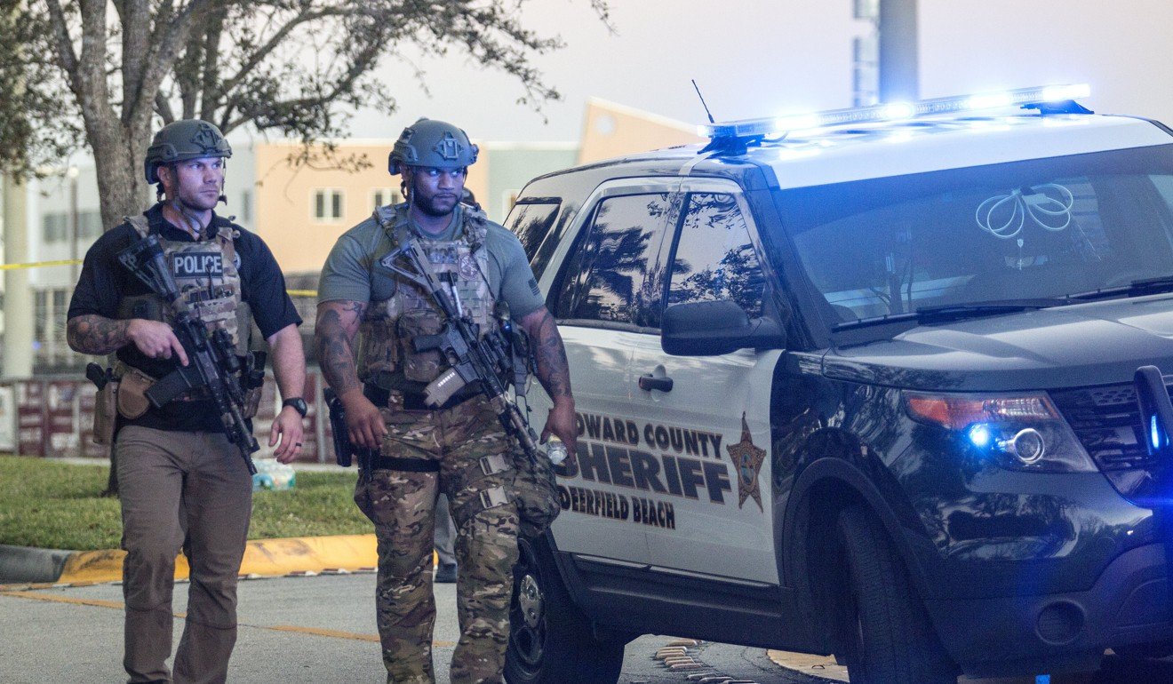 Two SWAT officers at Marjory Stoneman Douglas High School after the shooting in Parkland, Florida. Photo: EPA