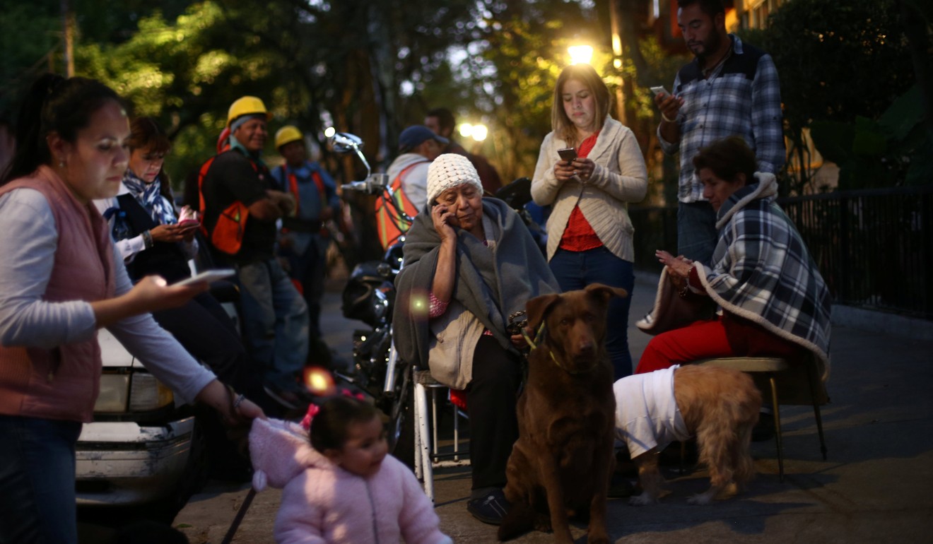 People rushed out of their buildings and onto the streets when the quake hit at about 5.39pm, fearing a repeat of last September’s disaster. Photo: Reuters