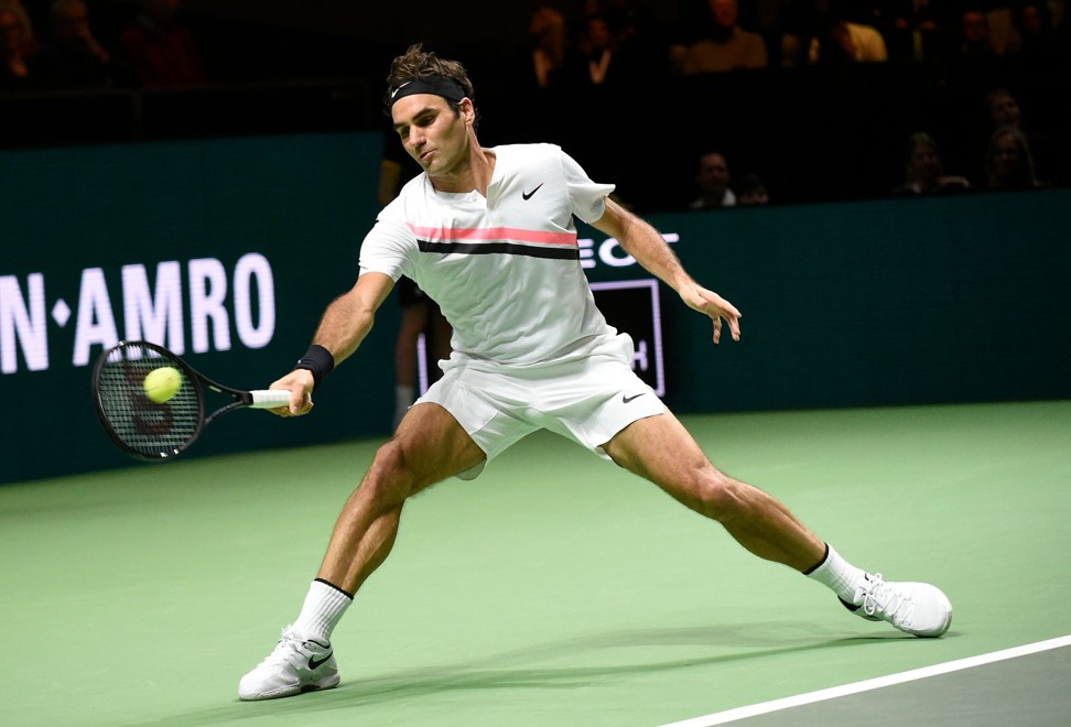 Federer plays a forehand return to Haase. Photo: AFP