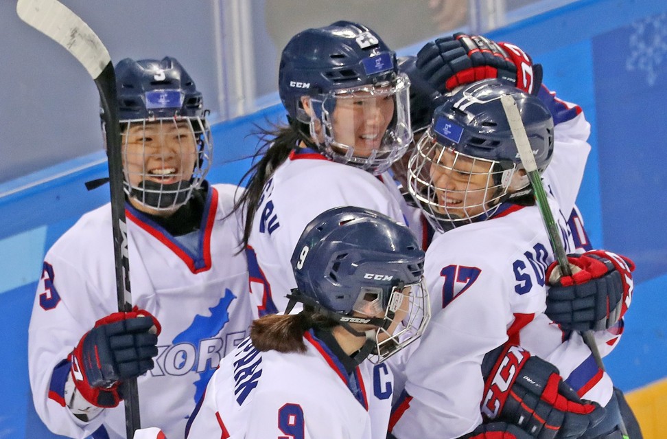 The Korean players celebrate after scoring against Sweden. Photo: EPA