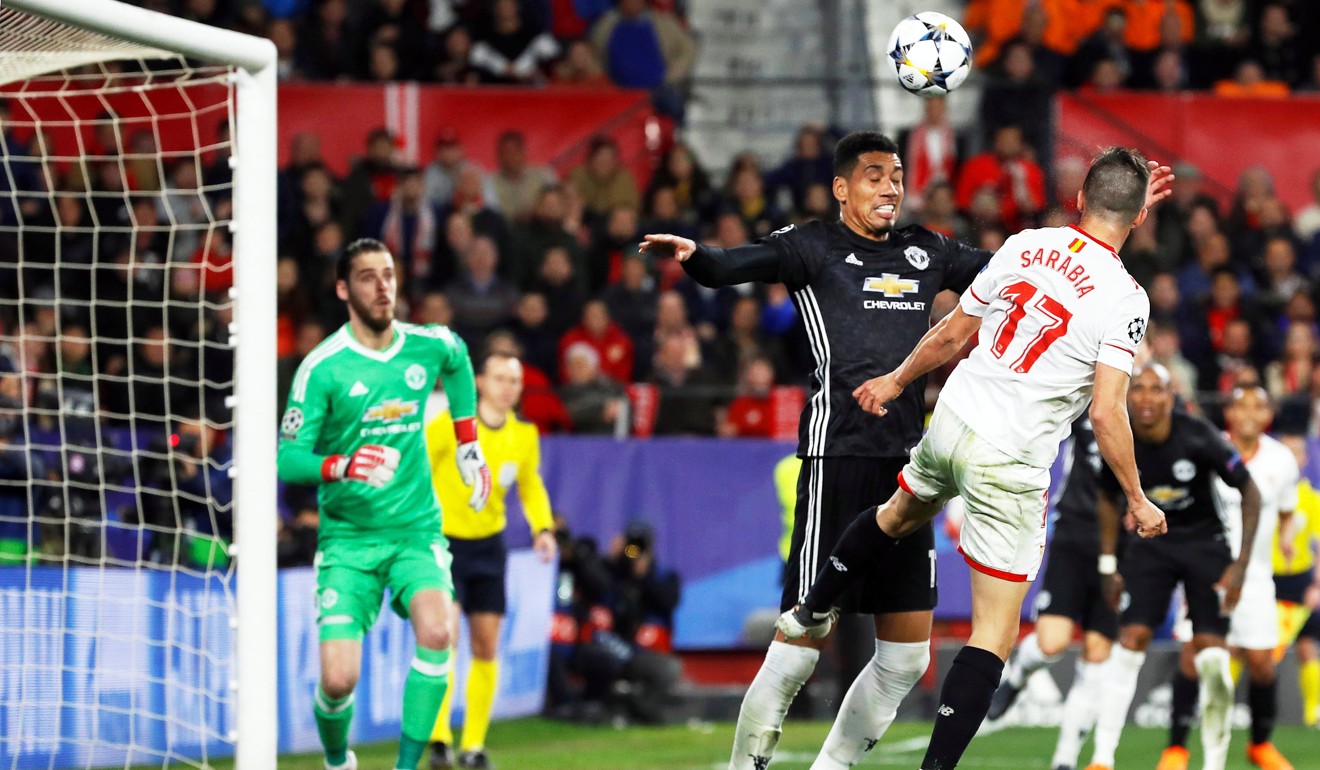 Sevilla’s Pablo Sarabia (R) in action against Manchester United’s Chris Smalling. Photo: EPA