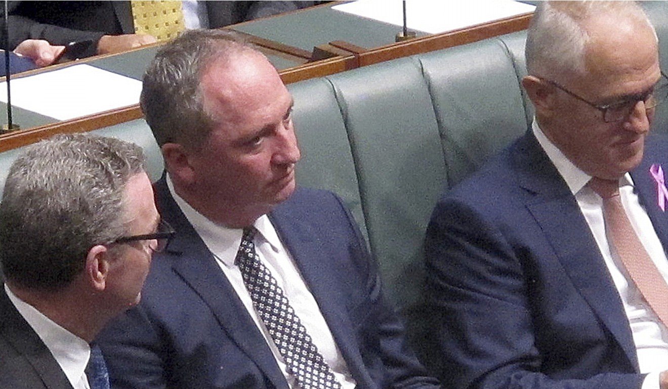 Australian Deputy Prime Minster Barnaby Joyce (centre) sits with colleagues including Prime Minister Malcolm Turnbull during a session in the Australian Parliament. Photo: AP