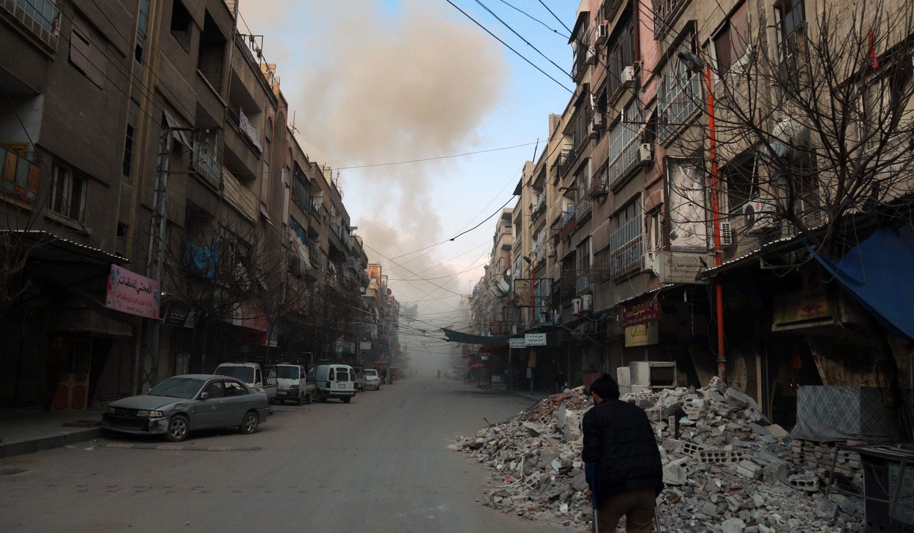 A Syrian man walks down a street in the rebel-held town of Douma. Photo: AFP