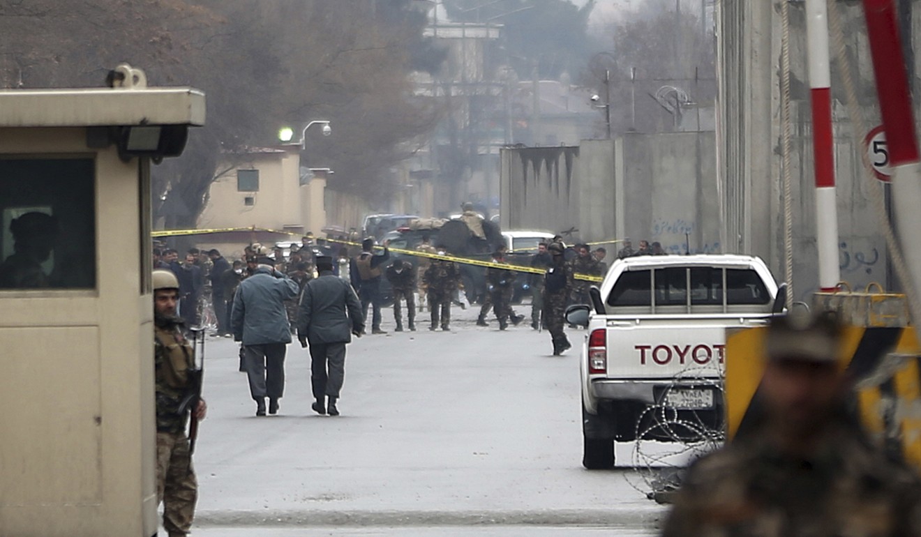 Security forces inspect the site of a suicide bombing in the diplomatic area of Kabul on Saturday. Photo: AP