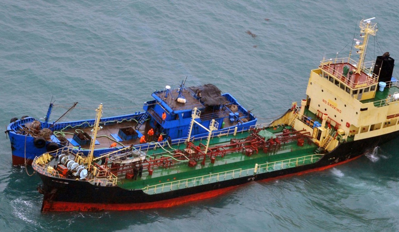 This February 16, 2018 photo shows what Japan’s Ministry of Defence says is North Korean-flagged tanker Yu Jong 2 (left) and a vessel with “Min Ning De You 078” written in Chinese on its bow apparently transferring something in pipes between their ships. Japan said it believed this was in contravention of the North Korean sanctions. Photo: Japanese Ministry of Defence via AP