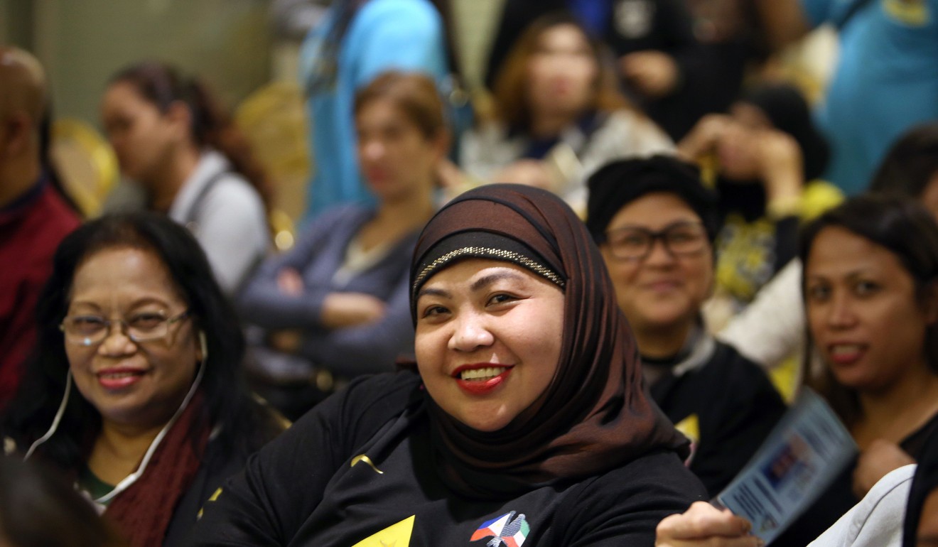 Members of the Filipino community working in Kuwait at the meeting in the embassy. Photo: AFP