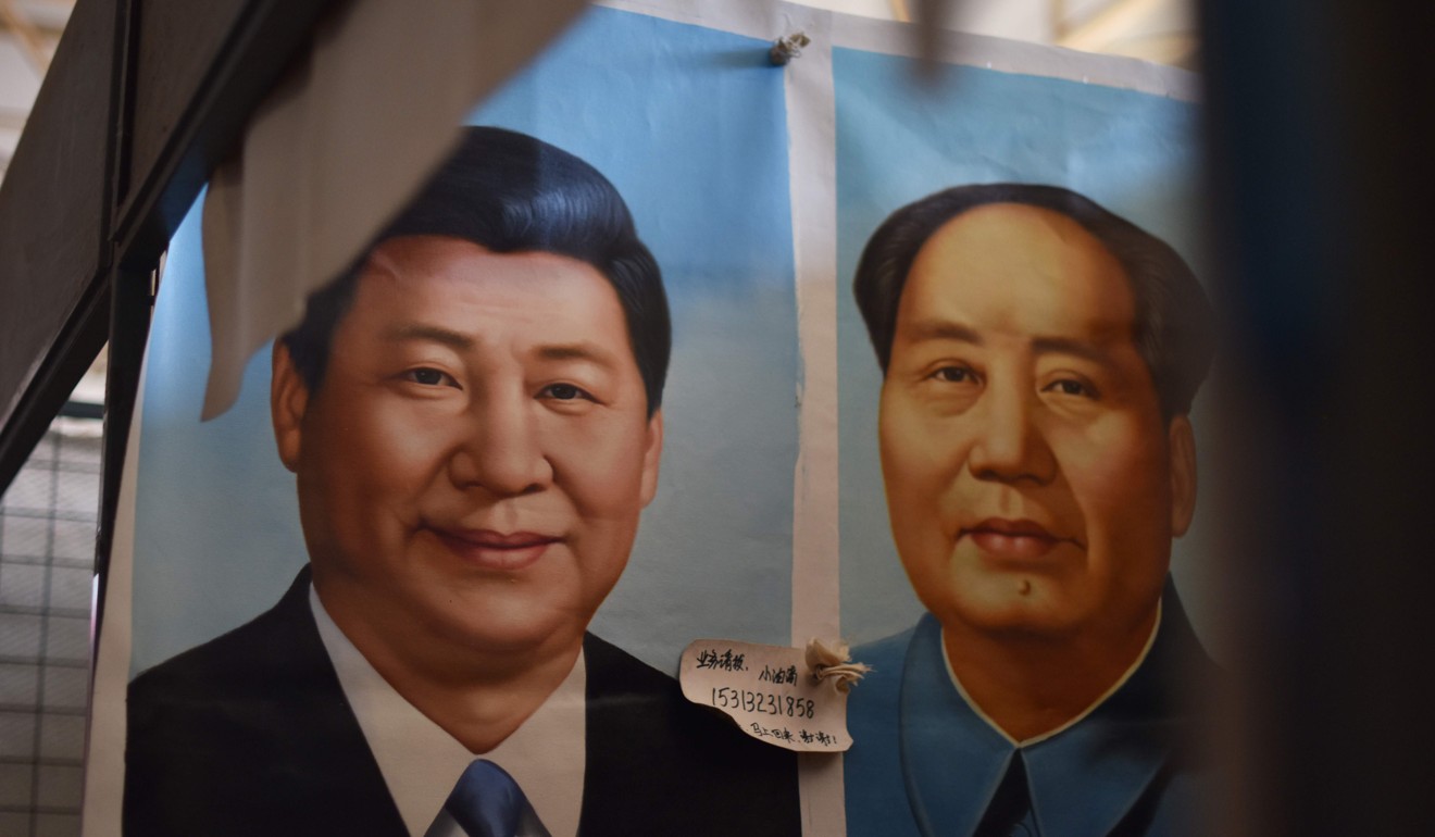 Portraits of Chinese President Xi Jinping and late Communist Party leader Mao Zedong are displayed at a market in Beijing. Photo: AFP 