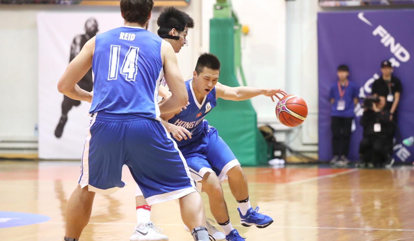 Lee Ki (centre) tries to drive through the China defence.