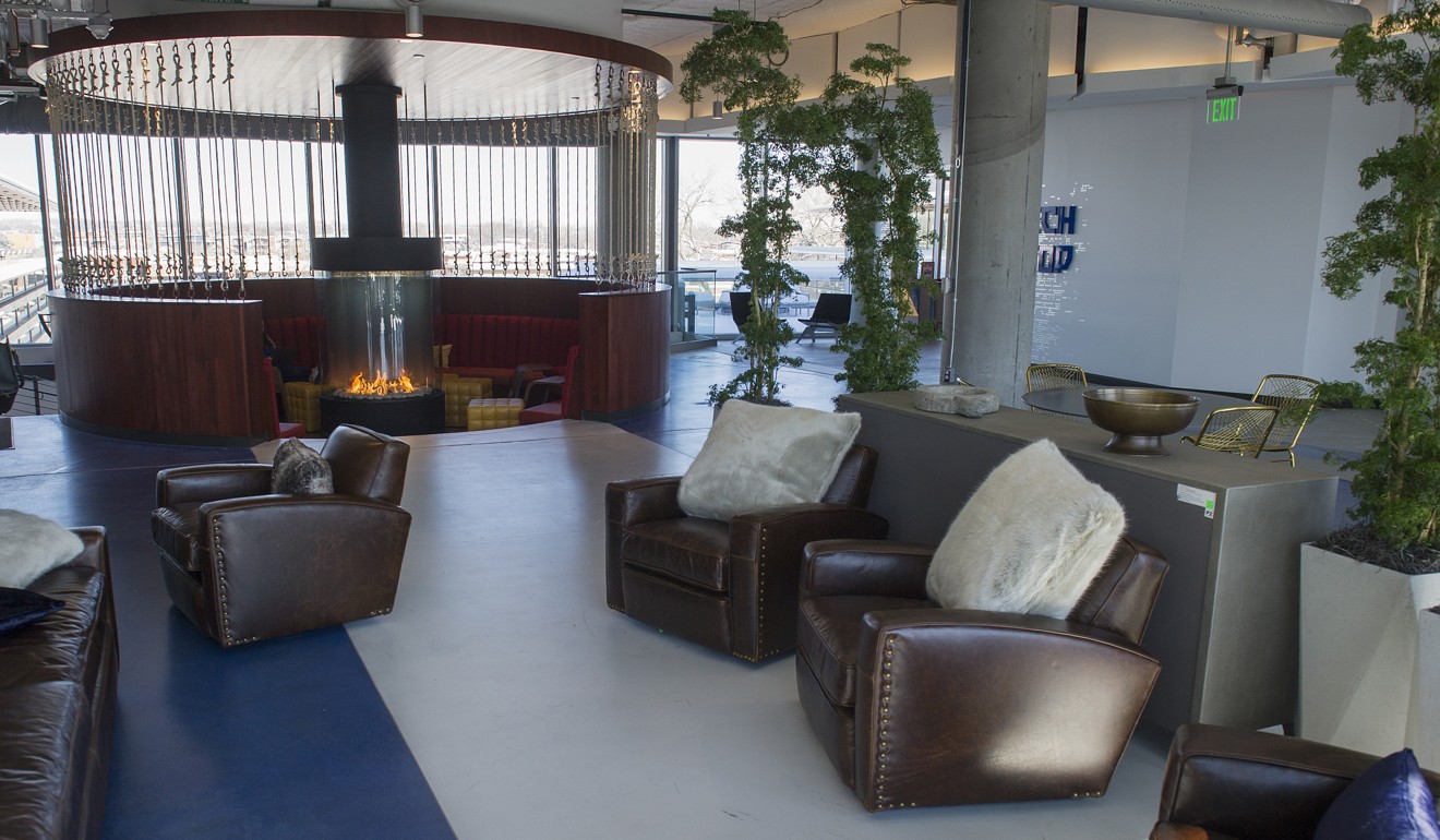 Furniture and a fireplace sit in an open work space at the Google campus. Photo: Bloomberg