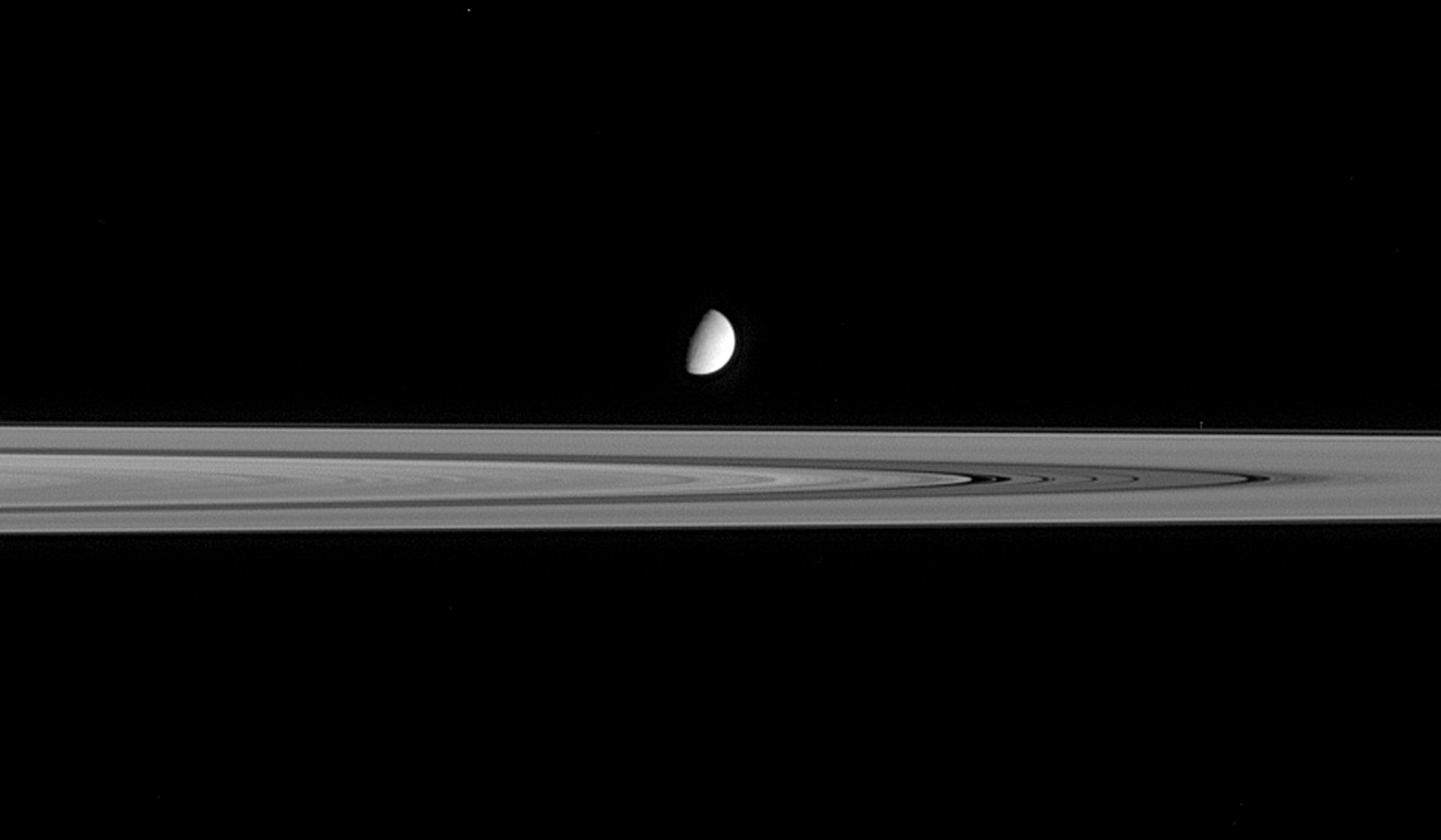 A Nasa photo from 2005 shows Enceladus seeming to hover above the outer reaches of Saturn's B ring. Photo: Nasa/JPL via AFP