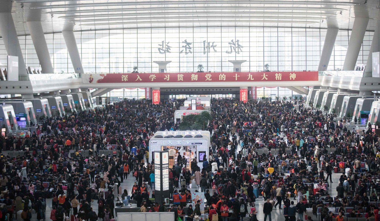 Thousands of passengers line up to board trains at Hangzhou railway station in eastern China’s Zhejiang province ahead of the Lunar New Year. Hundreds of millions return home to celebrate the Lunar New Year with their families. Photo: AFP