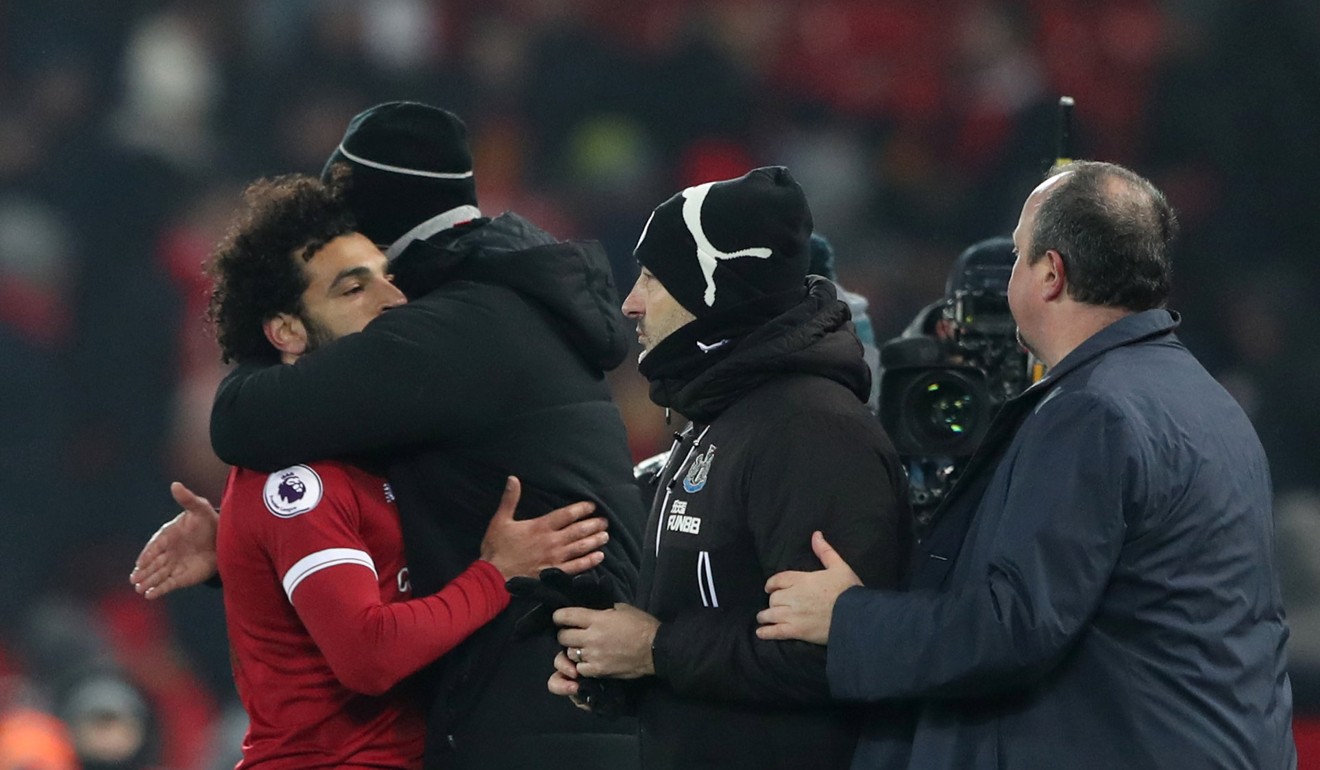 Juergen Klopp and Mohamed Salah celebrate after the match. Photo: Reuters