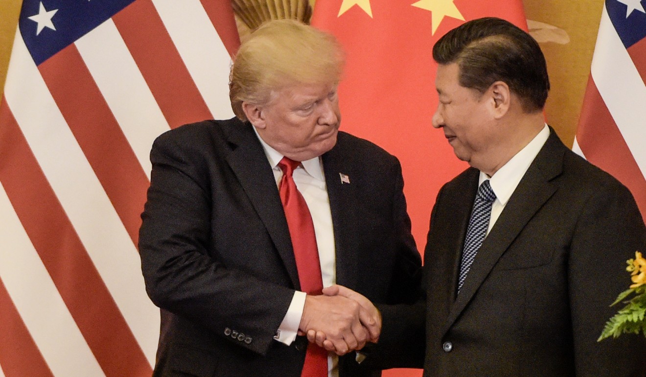US President Donald Trump (left) gives President Xi Jinping a taste of his signature handshake at the Great Hall of the People in Beijing in November 2017. Some in the US administration hold the view that Xi will not retaliate to Trump’s trade war gambit. Photo: AFP