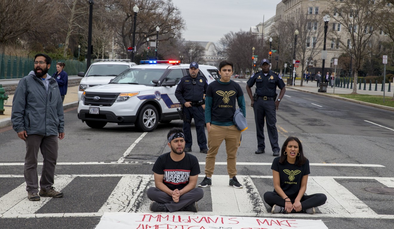 Undocumented youth and their allies shut down a street after a 250-mile Walk to Stay Home in Washington on March 1, 2018 as their fate is effectively in limbo. Photo: EPA-EFE