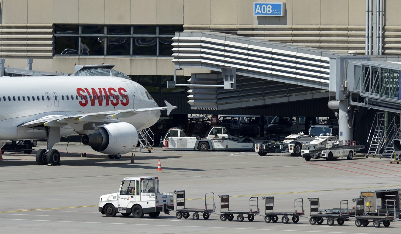 A Swissport baggage cart is seen at Zurich airport in Switzerland. The Swiss luggage handler, owned by China’s HNA Group, had its ratings outlook downgraded by Moody’s on Wednesday. Photo: EPA