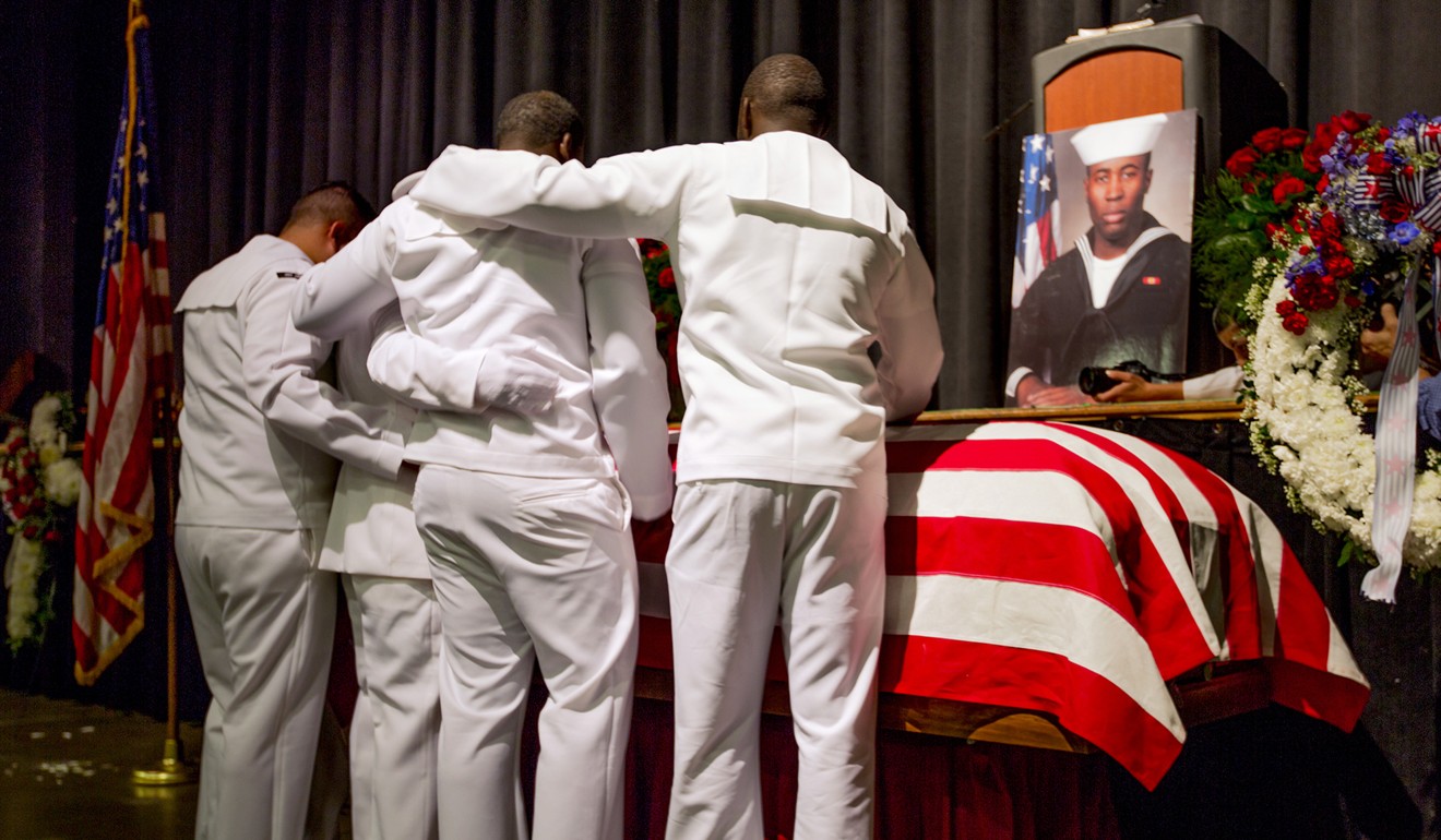 Sailors mourn at the casket of Corey Ingram, who was among the 10 US sailors killed when the USS John McCain collided with an oil tanker off Singapore on August 21. Photo: AP