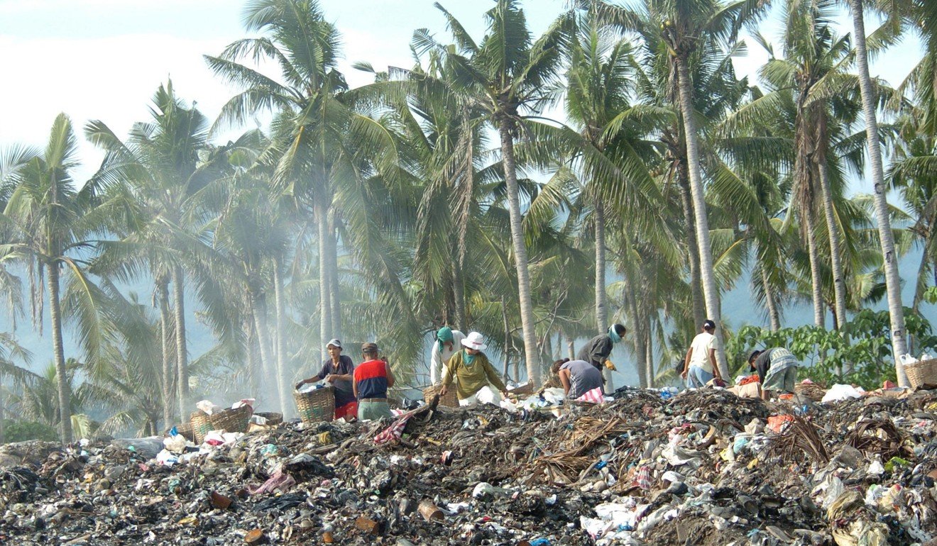 Scavengers sift through a rubbish dump on Boracay. Picture: AFP