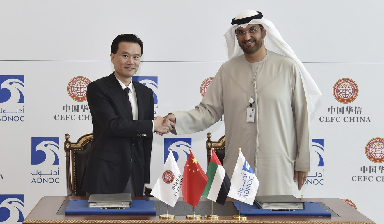 CEFC chairman Ye Jianming (left) shakes hands with Abu Dhabi National Oil chief executive Sultan Ahmed Al Jaber. Photo: Xinhua
