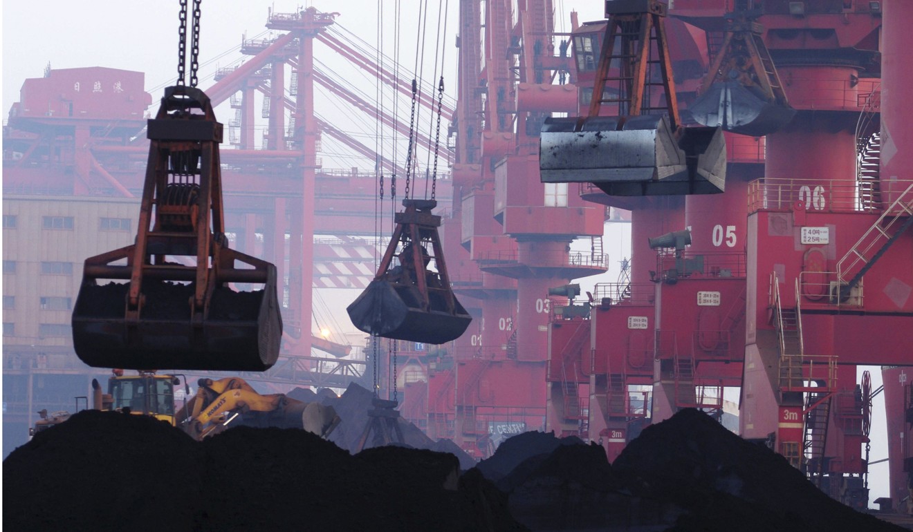 Imported iron ore in Rizhao, Shandong province, in June 2015. China imported US$1.84 trillion worth of commodities last year. Photo: Chinatopix via AP