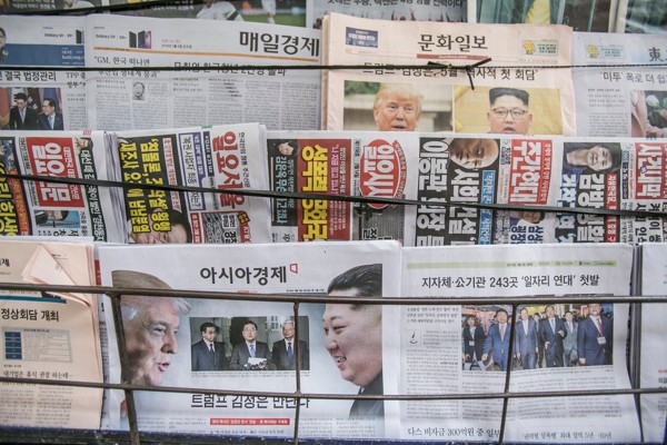 Newspaper front pages featuring news reports Trump has agreed to meet Kim Jong-un, displayed at a news stand in Seoul. Photo: Bloomberg