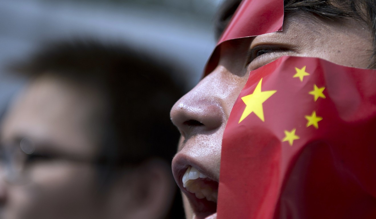 A Chinese national living in Malaysia shouts slogans during a protest in front of the Japanese embassy in Kuala Lumpur on September 19, 2012, against Japan's “nationalising” of disputed islands. Photo: Agence France-Presse