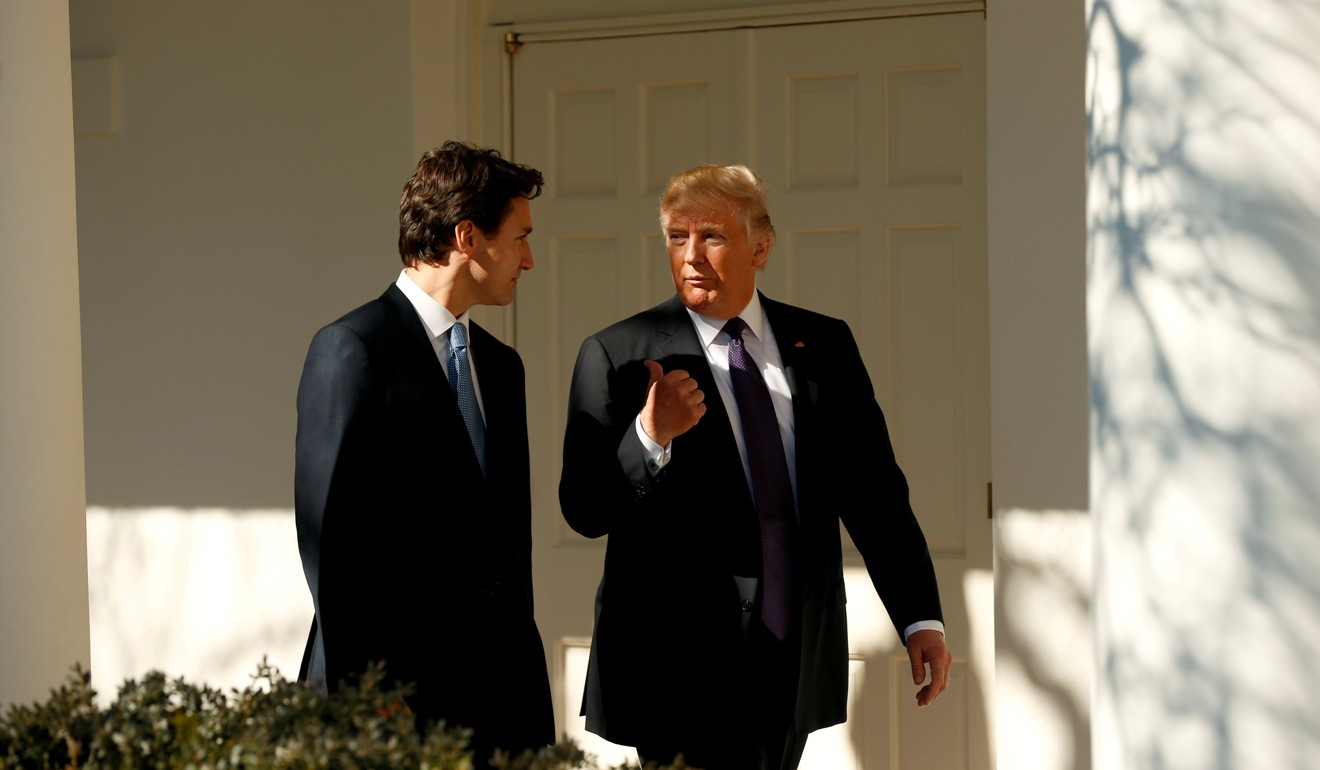 US President Donald Trump and Canadian Prime Minister Justin Trudeau walk at the White House on February 13, 2017. Photo: Reuters