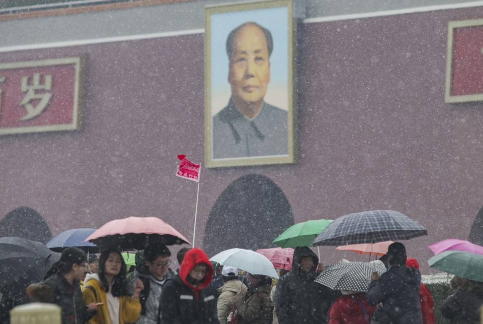 Tourists visit Tiananmen Square in the snow on Saturday. Photo: Simon Song