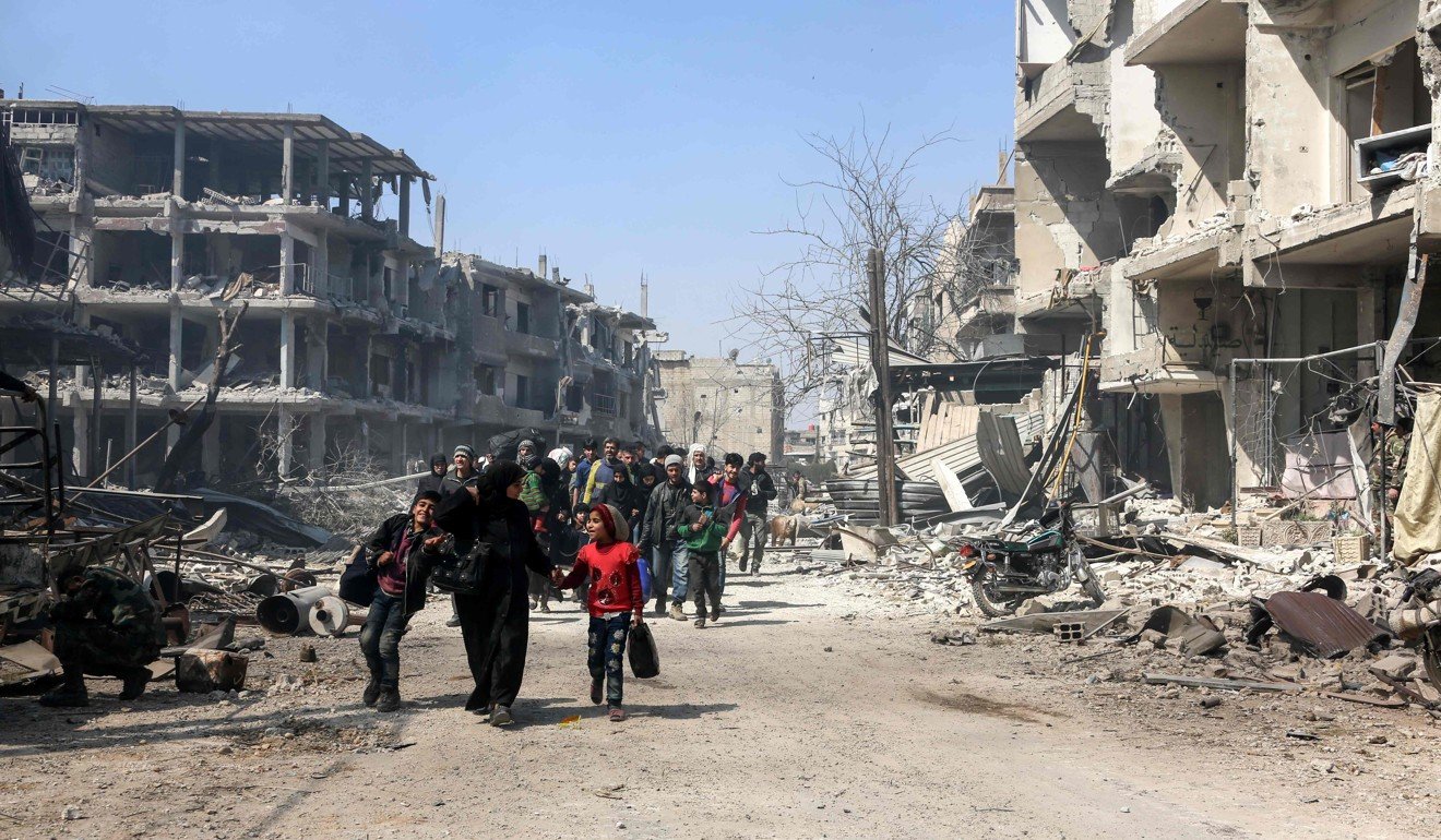 Syrian civilians evacuating the town of Jisreen in eastern Ghouta. Photo: AFP