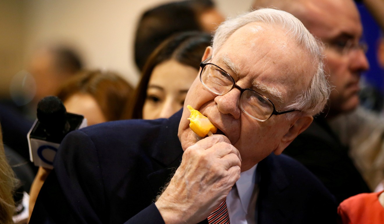 The eternally youthful Berkshire Hathaway chairman and CEO Warren Buffett, 87, enjoys an ice cream before its annual meeting in Omaha, Nebraska last May. Photo: Reuters