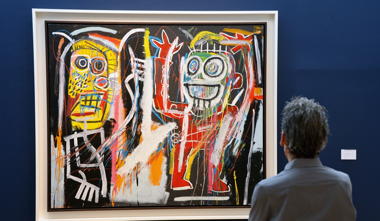 ‘Dustheads’ by US artist Jean-Michel Basquiat during a preview at Christie's in New York. The auction house recorded an 86 per cent growth in online art sales in 2016. Photo: EPA