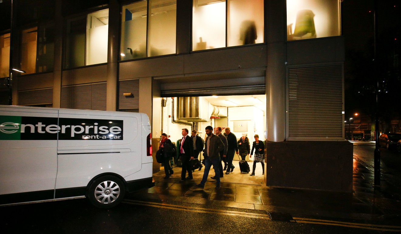 A van and a group of people leave the offices of Cambridge Analytica in London, as investigators from Britain's Information Commissioners Office conduct searches after it was revealed the firm harvested mass amounts of Facebook user data. Photo: Reuters