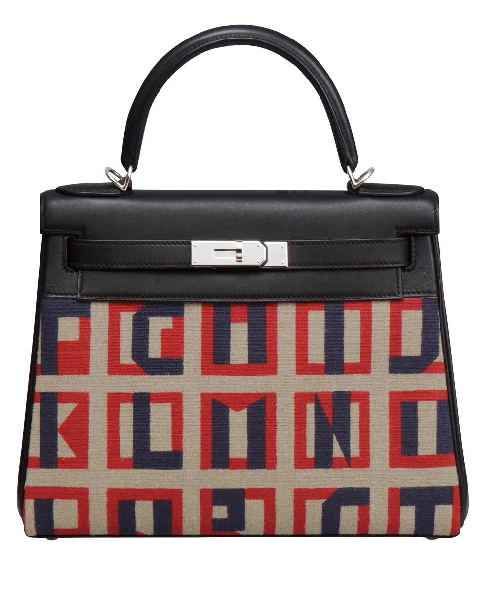 Hermès’ Kelly Retourné 28 bag in Lettres au carré print toile de camp and Swift calfskin.