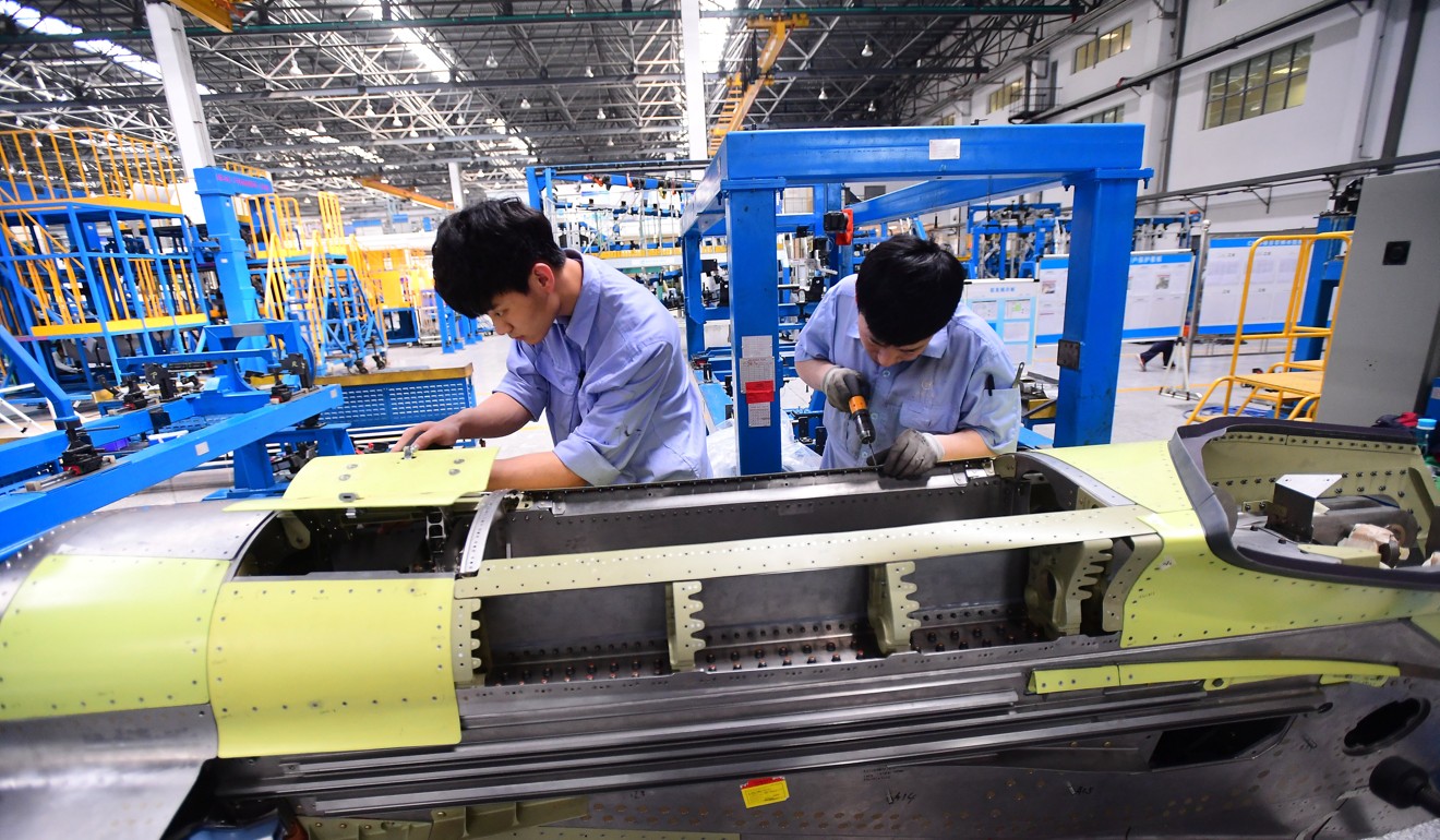 Workers on shift at an aircraft factory n Shenyang in Liaoning province. Photo: Reuters