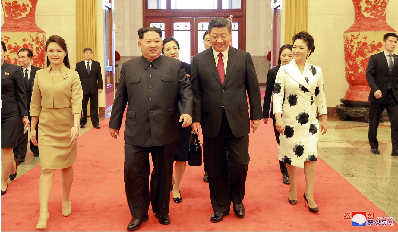 North Korean leader Kim Jong-un (centre left) and Ri Sol-ju (left) were greeted by President Xi Jinping and his wife Peng Liyuan on their arrival in Beijing. Photo: Reuters 