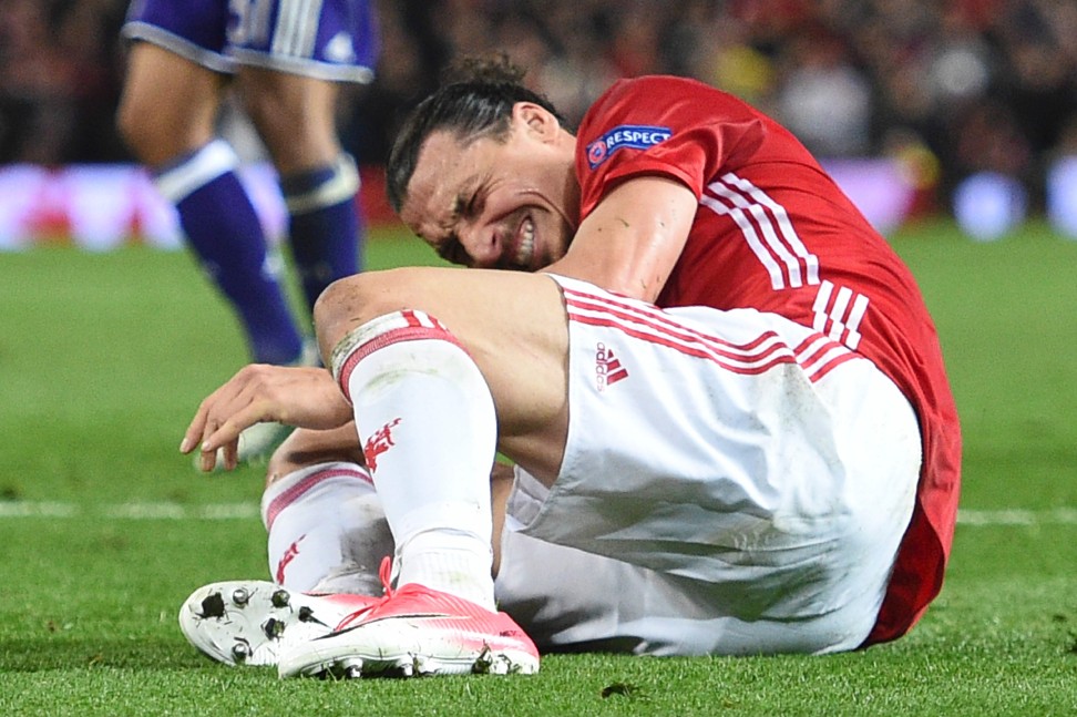 Zlatan Ibrahimovic suffers a serious knee injury against Anderlecht at Old Trafford. Photo: AFP