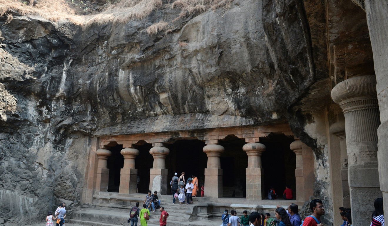 Tourists visit the temple caves on Elephanta Island. Photo: AFP