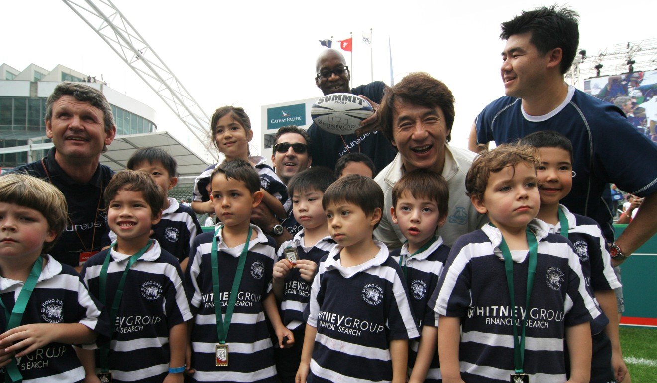 Chan poses with mini rugby players from the Hong Kong Football Club at the rugby Sevens, in 2006. Photo: Robert Ng