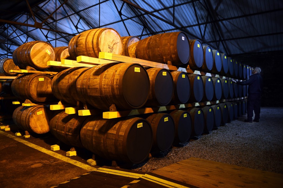 The oak barrels of whisky can be stored for up to 25 years before bottling, at the Auchentoshan Distillery near Glasgow, Scotland. Photo: AFP
