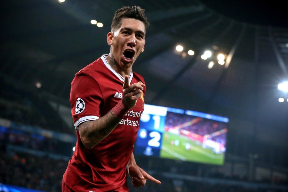 Roberto Firmino celebrates after making it 2-1 on the night and 5-1 on aggregate. Photo: EPA