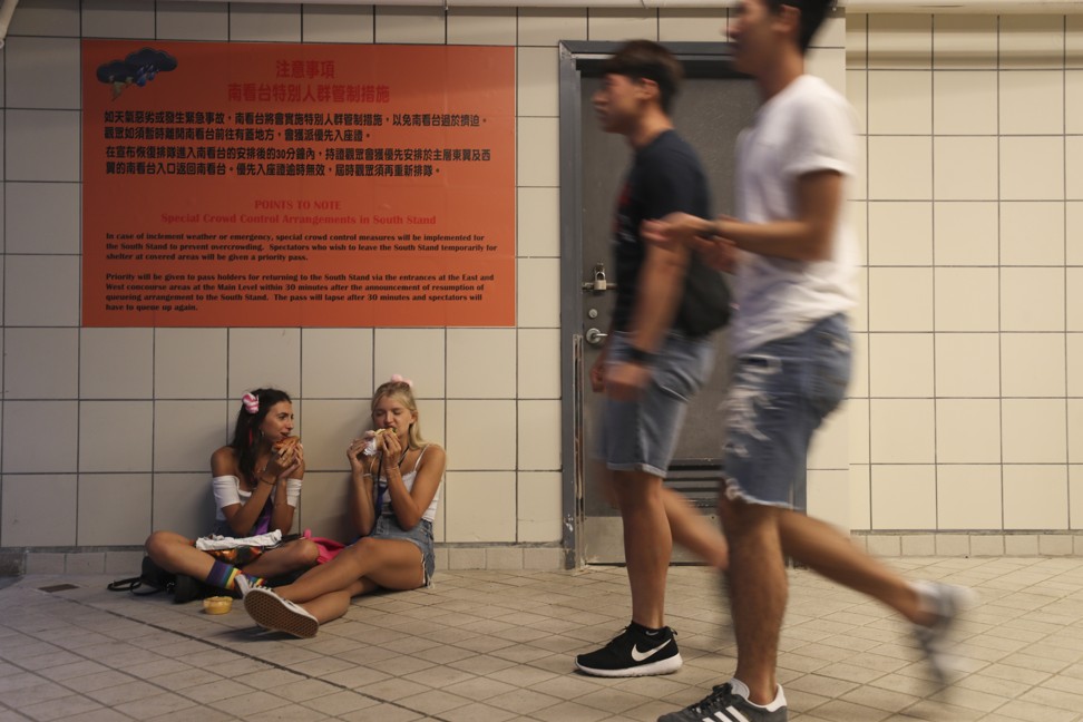 Fans take a timeout in the underbelly of Hong Kong Stadium. Photo: Winson Wong