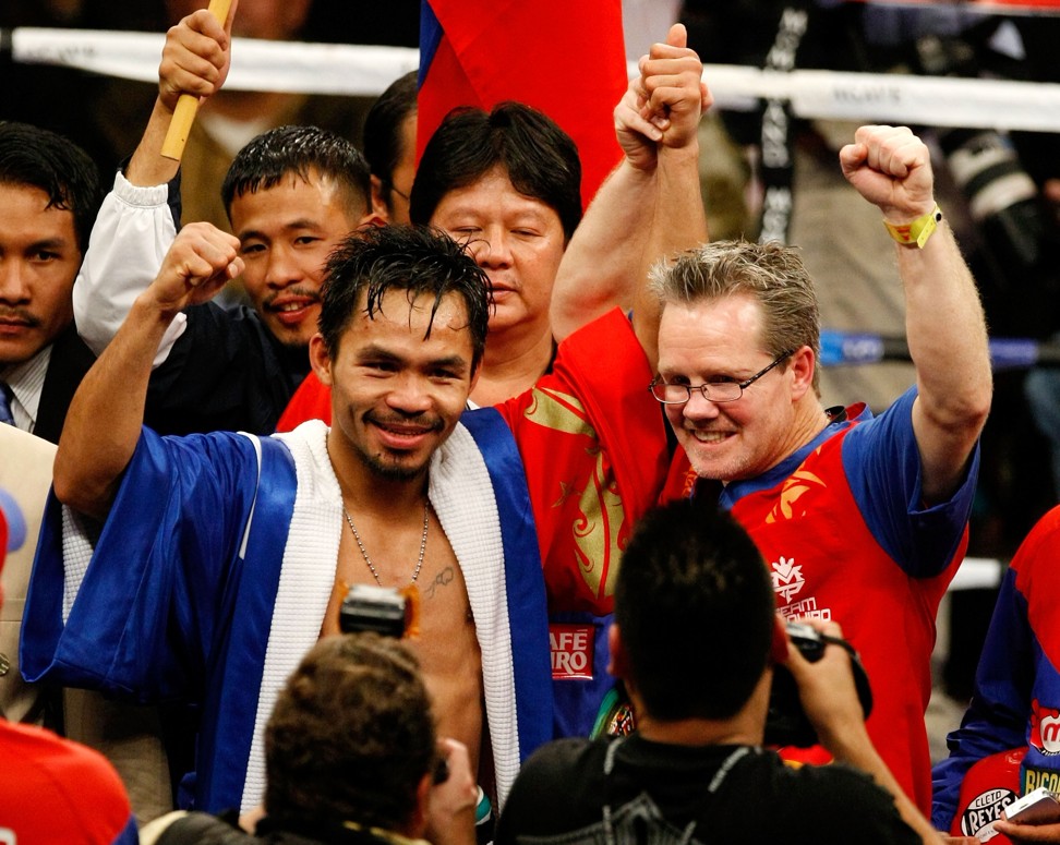 Pacquiao celebrates with Roach after defeating Oscar De La Hoya in their welterweight fight at the MGM Grand Garden Arena in 2008 in Las Vegas. Photo: AFP