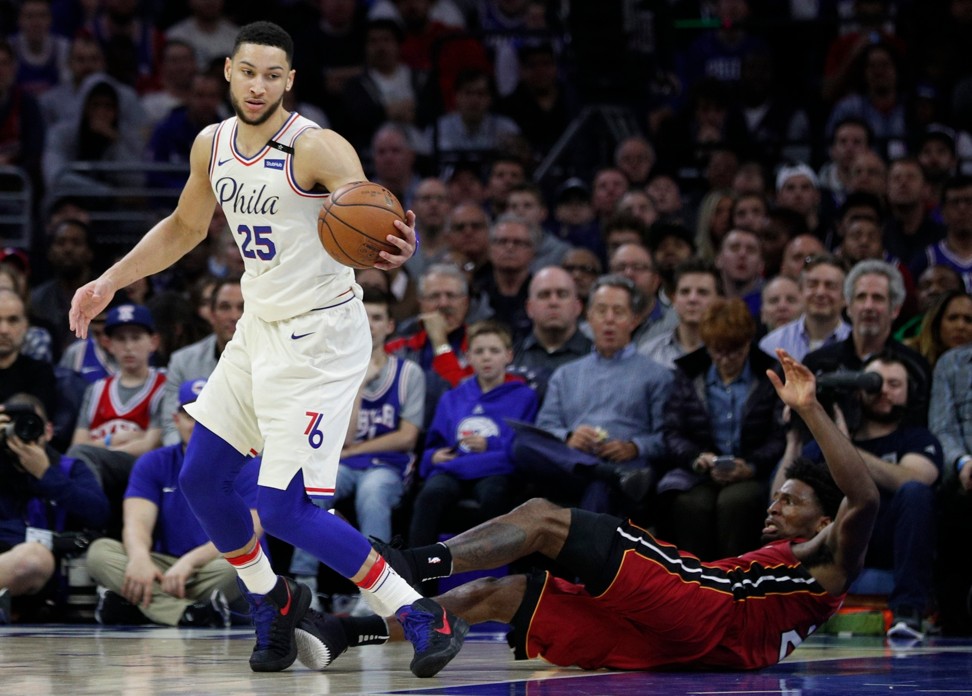 Miami Heat's Justise Winslow (right) hits the court after drawing a foul on Philadelphia 76ers’ Ben Simmons. Photo: AP