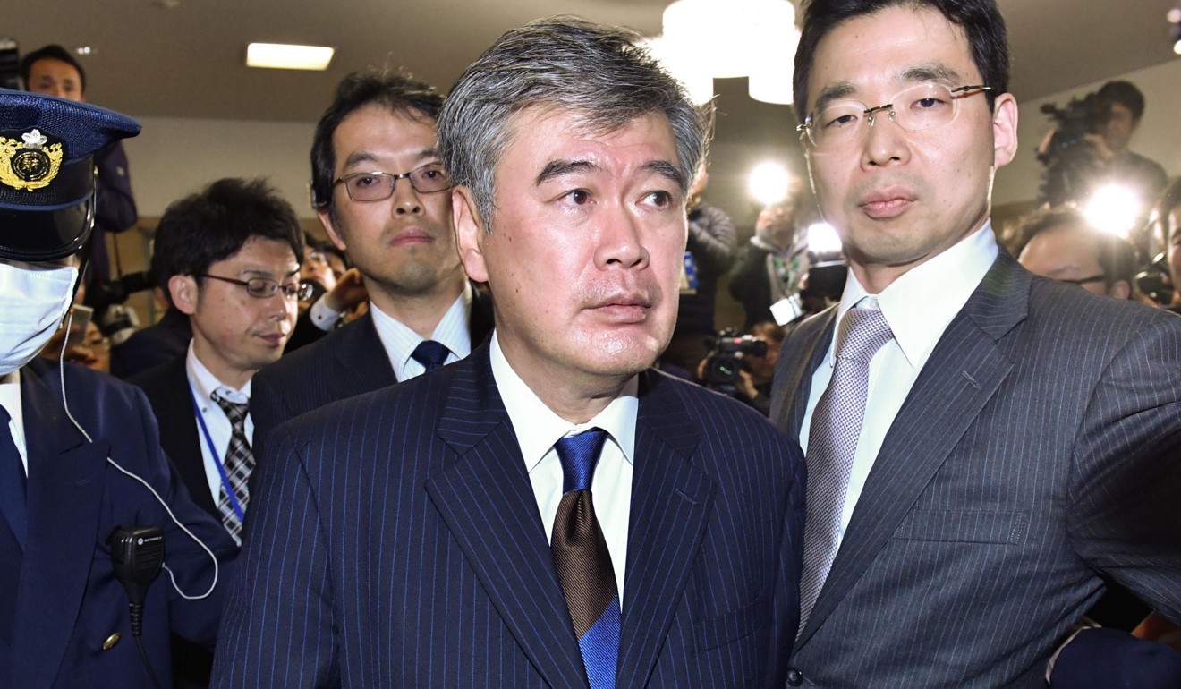 Japan's Vice Finance Minister Junichi Fukuda (centre) quit on Wednesday following allegations he sexually harassed female reporters, saying he wanted to clear his name. Photo: AP