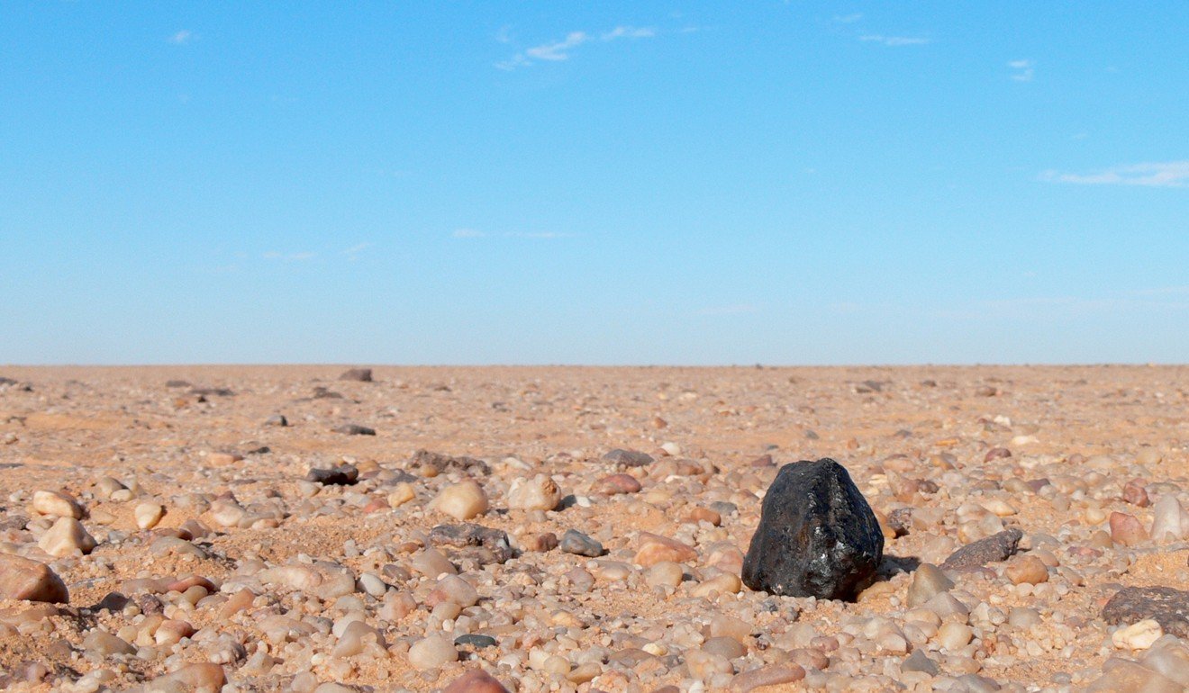 A black chunk of asteroid found in the Sudan desert in December 2008. Scientists studied the tiny space diamonds in the specimen and concluded the existence of a planet that did not survive the early days of the solar system. Photo: AP